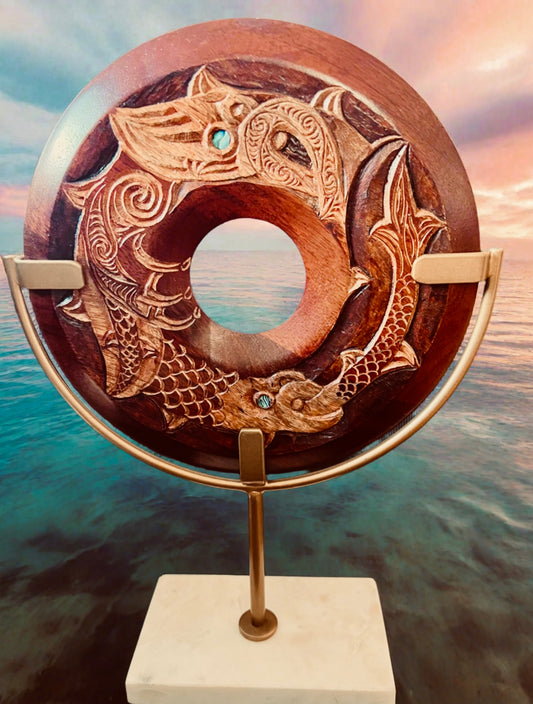 Manaia whakairo on brass/marble base